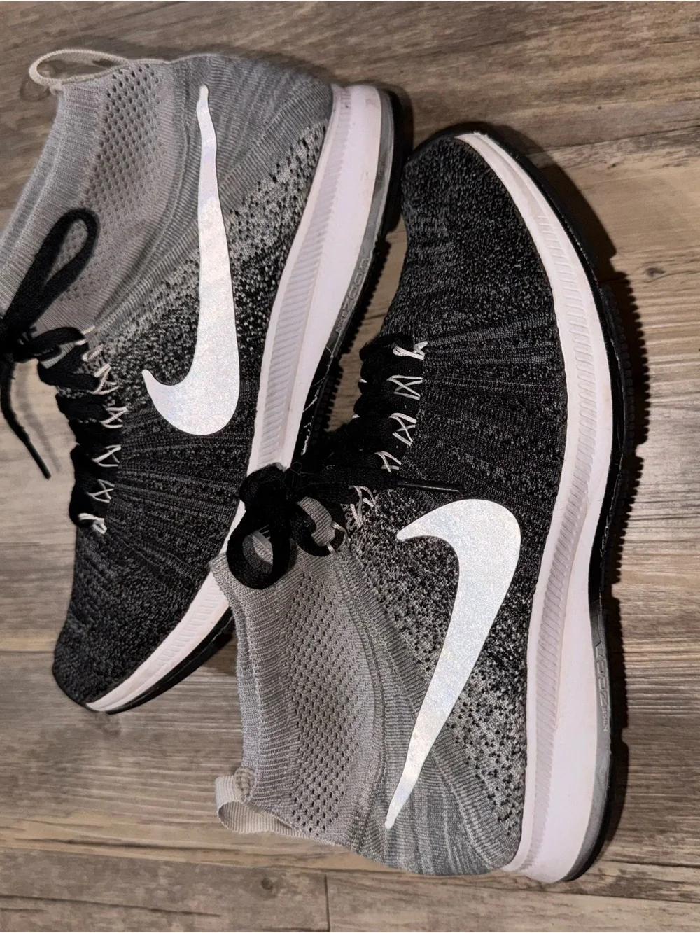 Nike Kids Black and Gray Flyknit High-Top Sneakers with White Swoosh